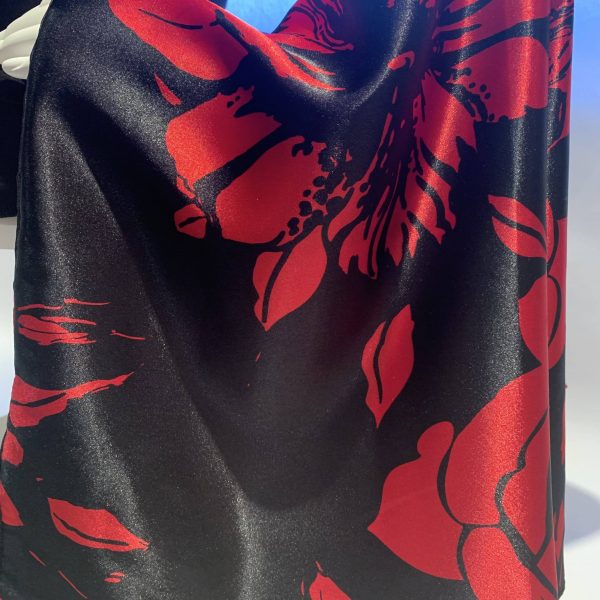 black red floral print fabric closeup